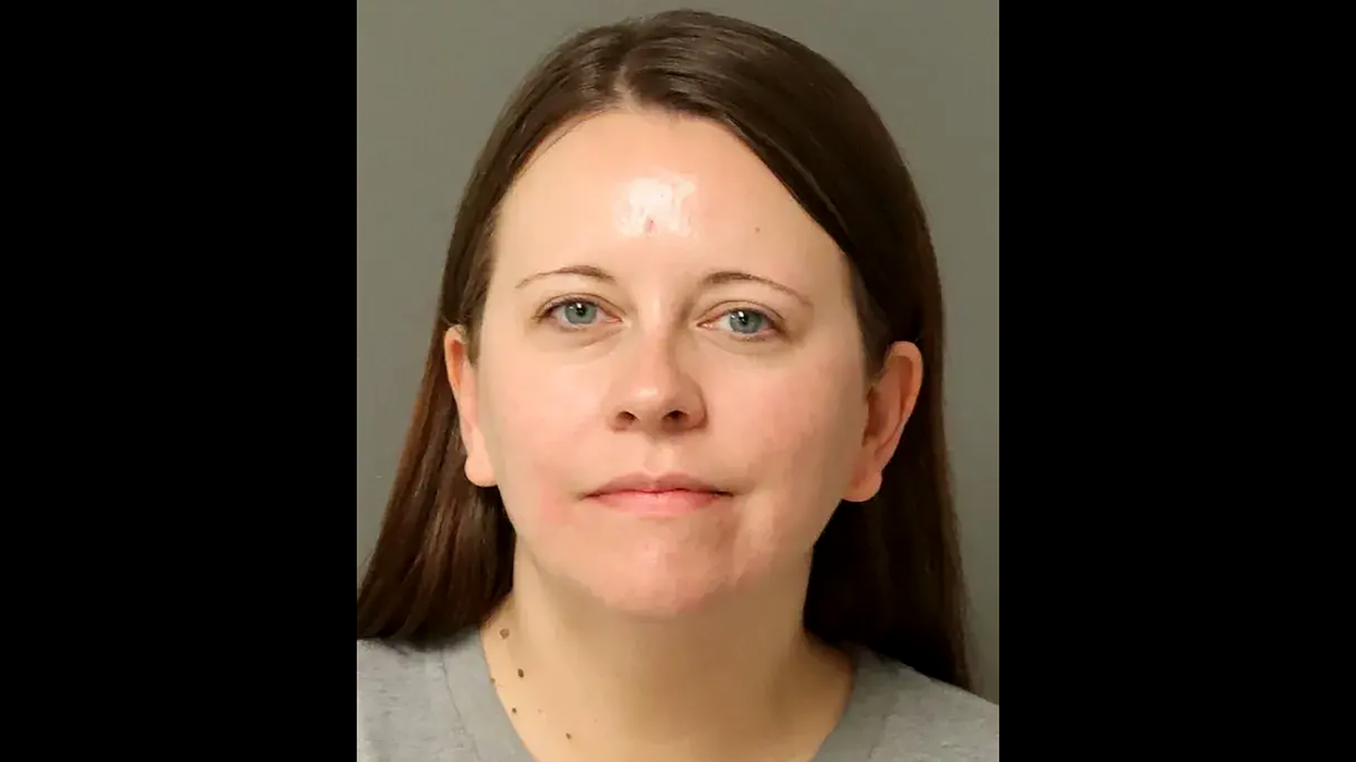 Aide to Republican state senator arrested for burning a house with 2 people inside: report