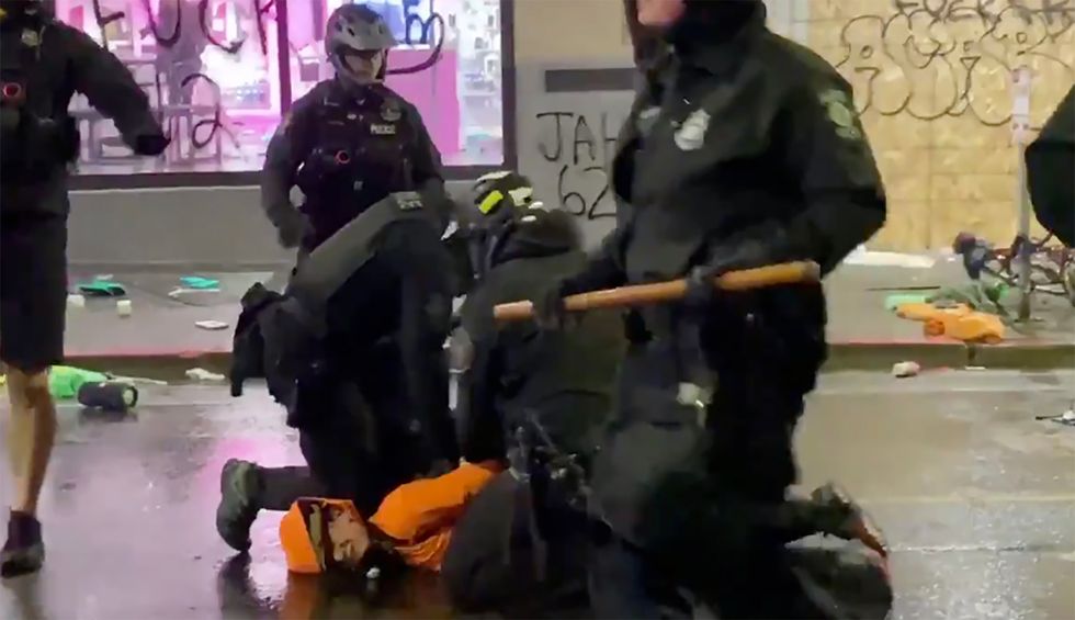 Video shows Seattle cop with knee on neck of George Floyd protestor