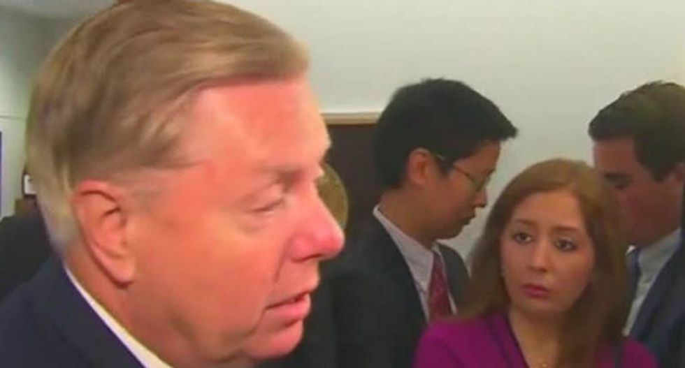 Lindsey Graham pivots to blame Democrats after Trump says he welcomes more foreign meddling