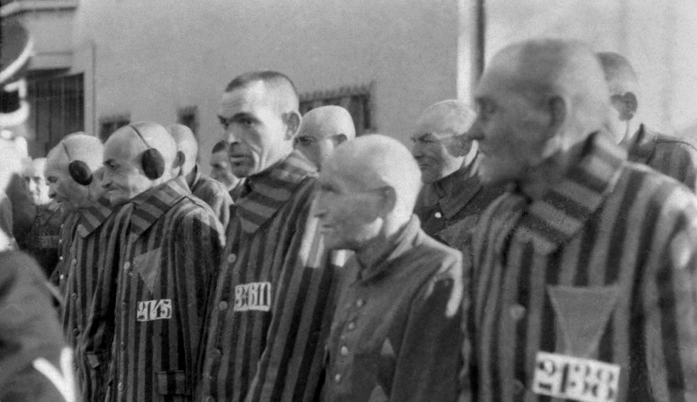 Alleged abuse by US border guards who forced detained migrant to wear humiliating sign around his neck reminiscent of Nazi camps