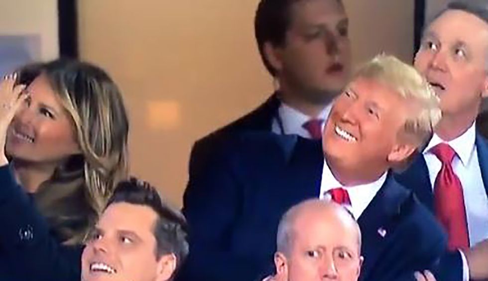 US President greeted with thunderous boos and 'impeach Trump' banner at World Series