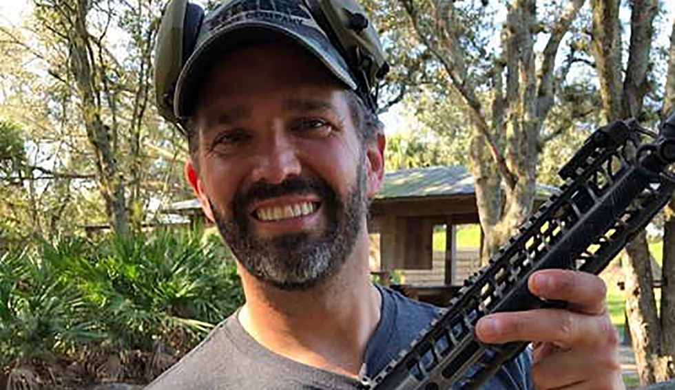 Don Jr posts photos of his assault rifle bearing ancient 'symbol of war with Islam' now 'used by white supremacists': experts