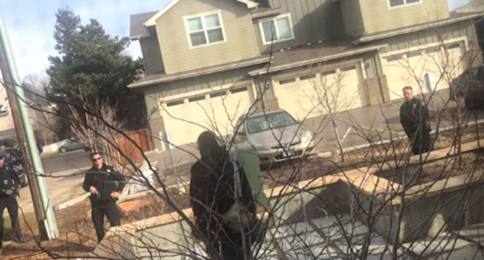 Watch: Colorado cops swarm and pull guns on black college student picking up trash in his own yard