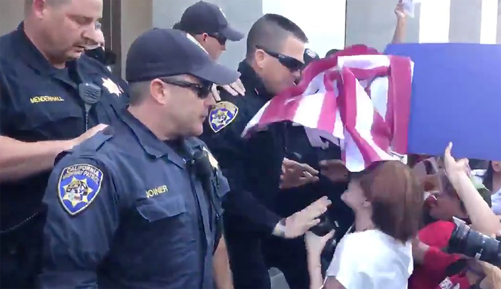 'White privilege': Critics rage against hypocrisy after police give passes to hoards of angry armed lockdown protesters
