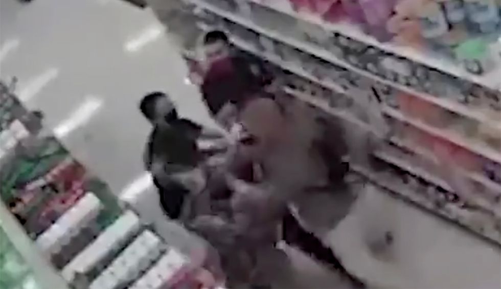 Two men caught on video breaking a Target employee's arm after he asked the shoppers to wear a mask