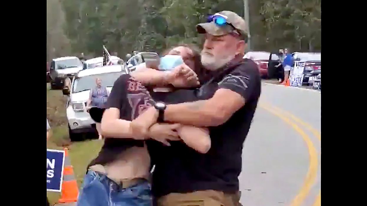 Armed Biden and Trump supporters involved in violent clash outside Georgia Democratic rally