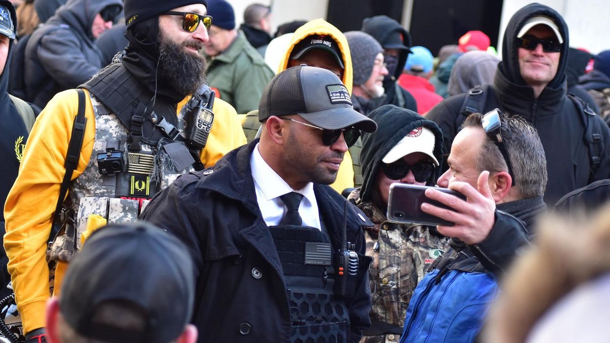 Michigan commissioner flashes gun during meeting when asked to denounce the Proud Boys