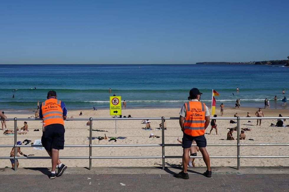 Australia aims to 'live with virus' instead of eliminating it