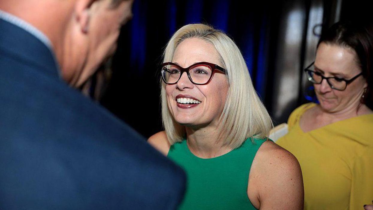 Manchin and Sinema face backlash after posting grotesque tweets congratulating themselves