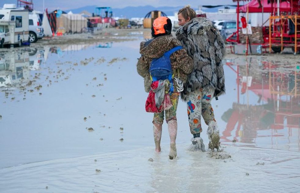 One death reported at Burning Man, thousands stranded in mud and rain