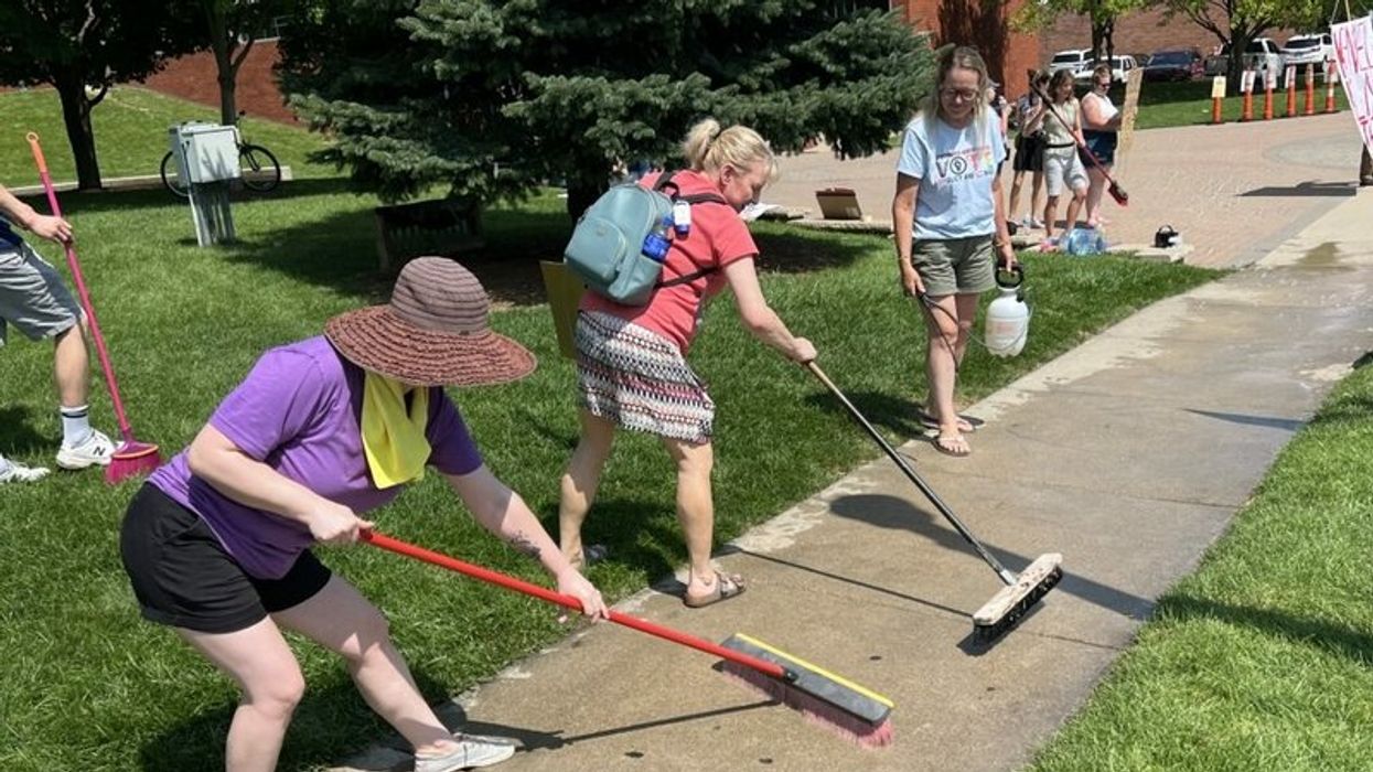 Residents symbolically cleanse Michigan town after white supremacist march