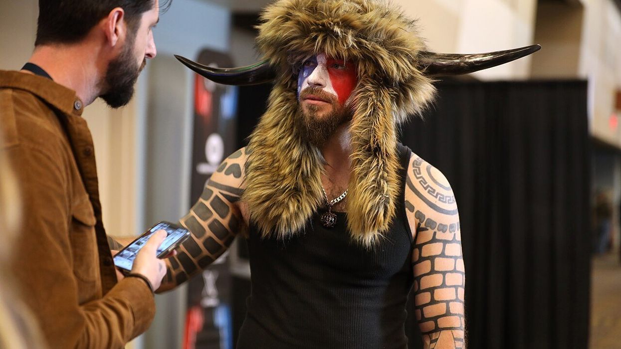 'QAnon Shaman' vows to 'buy some guns' after Trump’s Jan. 6 pardons