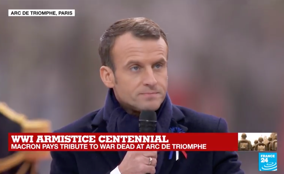 Macron delivers rebuke to nationalism as Trump looks on