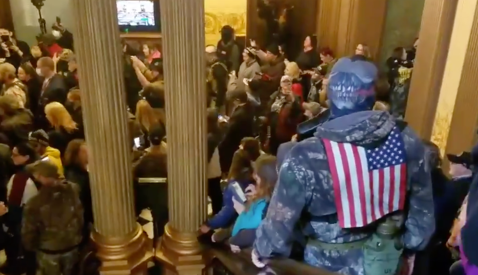 'America in the age of Trump': Armed gunmen enter Michigan Capitol demanding end to lockdown