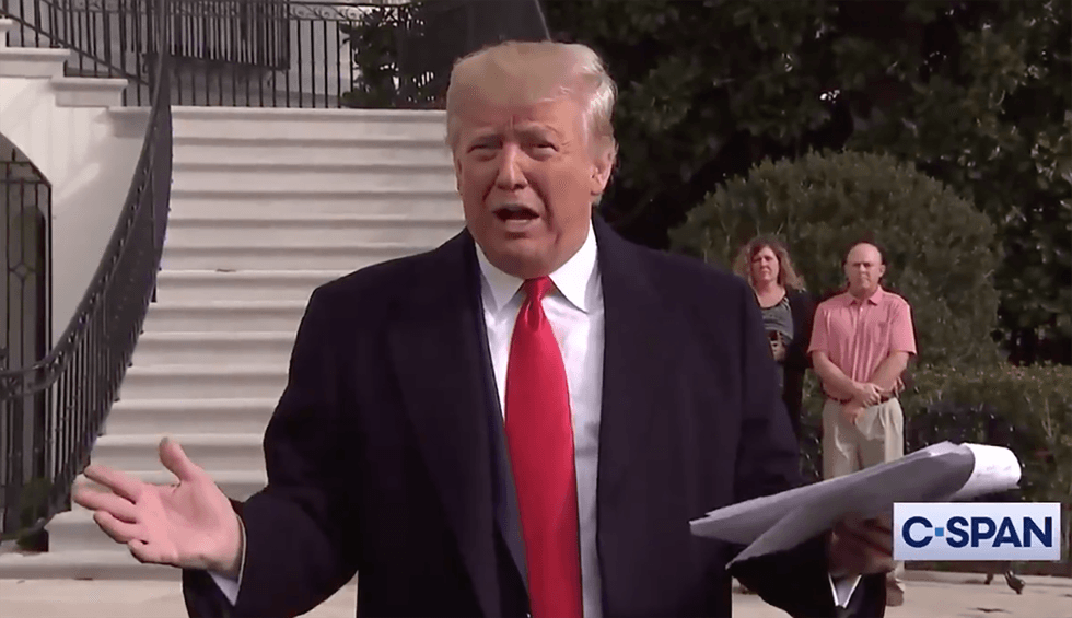 Reporters photograph Trump reading off notepad scratched with huge ...