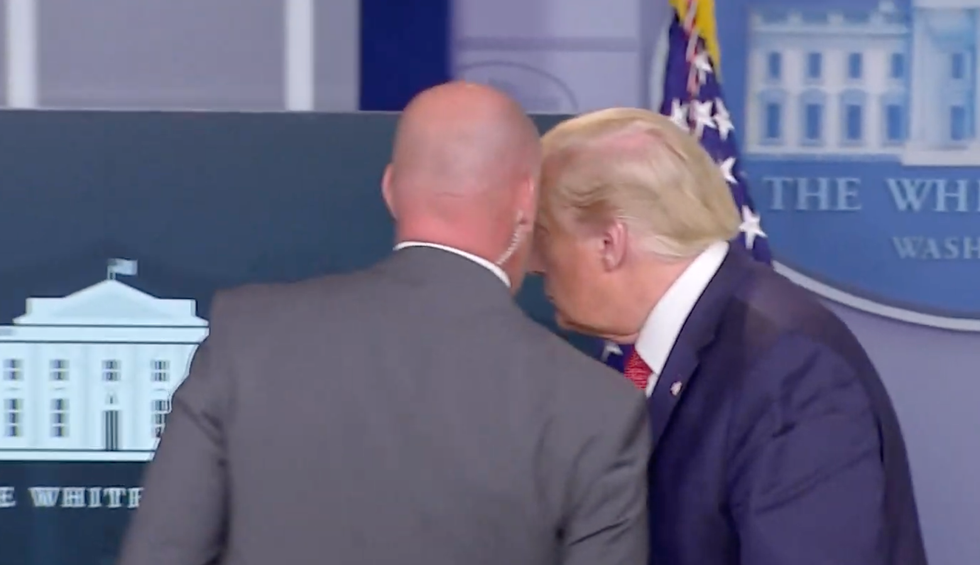 Trump suddenly evacuated from White House briefing after aide whispers in his ear