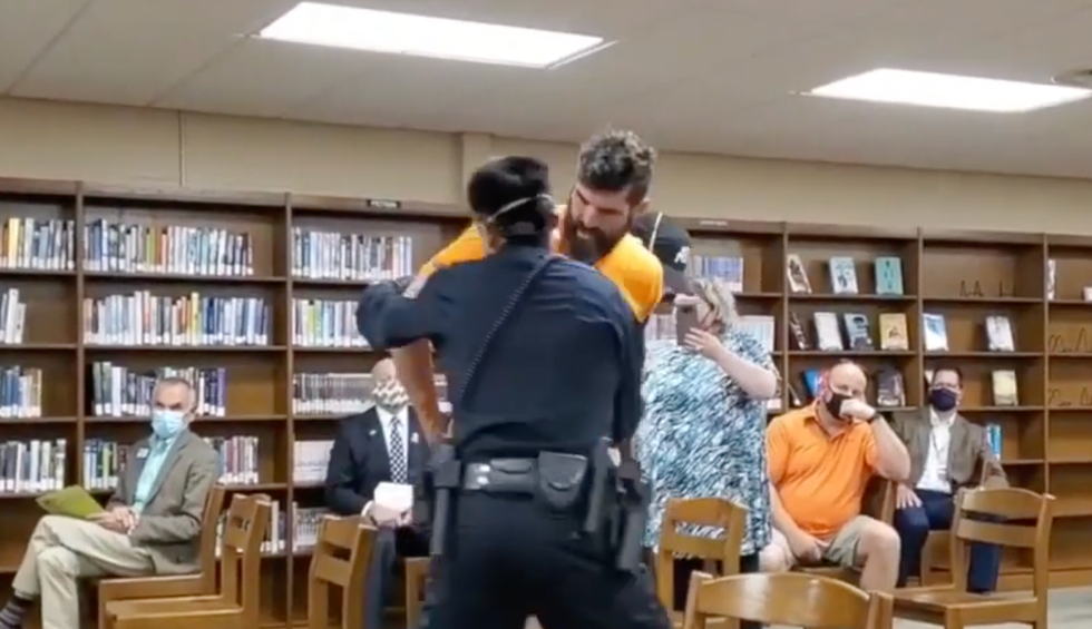 Anti-masker throws a South Dakota school board meeting into chaos