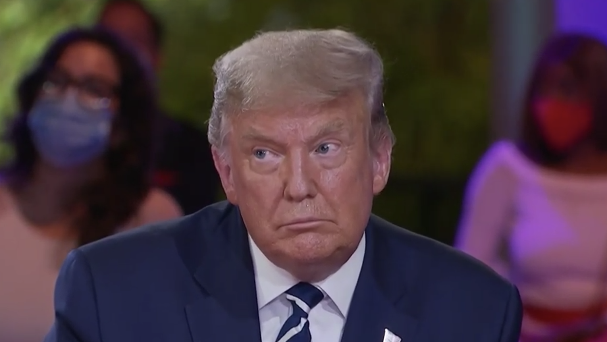 Trump is playing a dangerous and cynical game with QAnon
