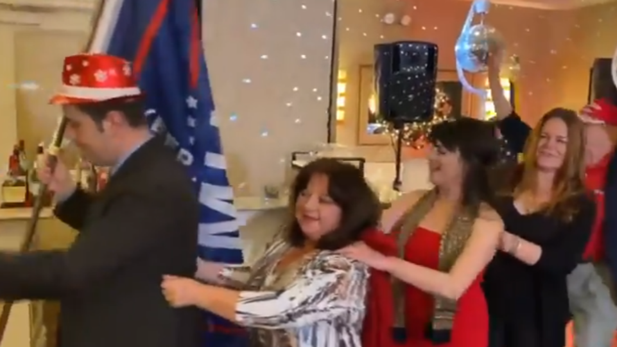 Watch: Viral video captures GOP club members dancing in conga line at maskless holiday party in NYC