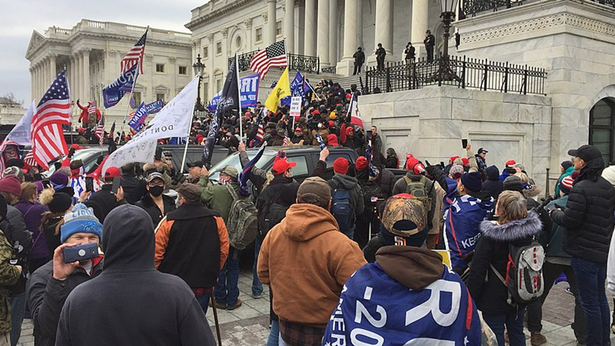 Michael Flynn associate among the first wave of rioters to breach Capitol barricades on January 6th