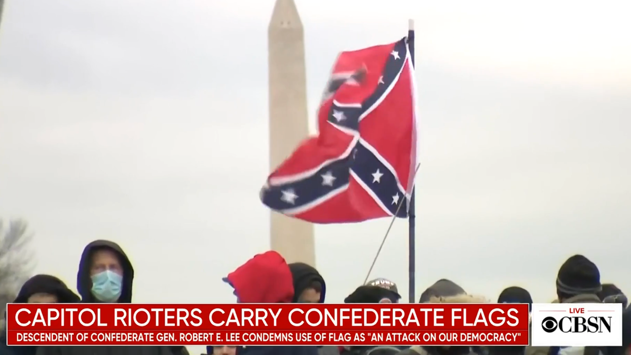 Insurrectionist who waved Confederate flag in Capitol allowed to take family road trip before trial