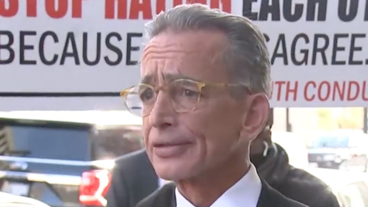 'QAnon shaman' lawyer unloads​ a string of profanity when asked what he'd say to Trump about Jan. 6