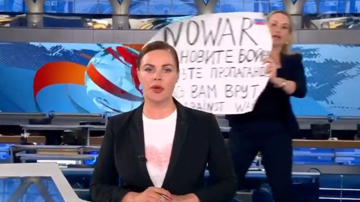 News editor who flashed 'no war' poster on Russian television facing 15 years in prison