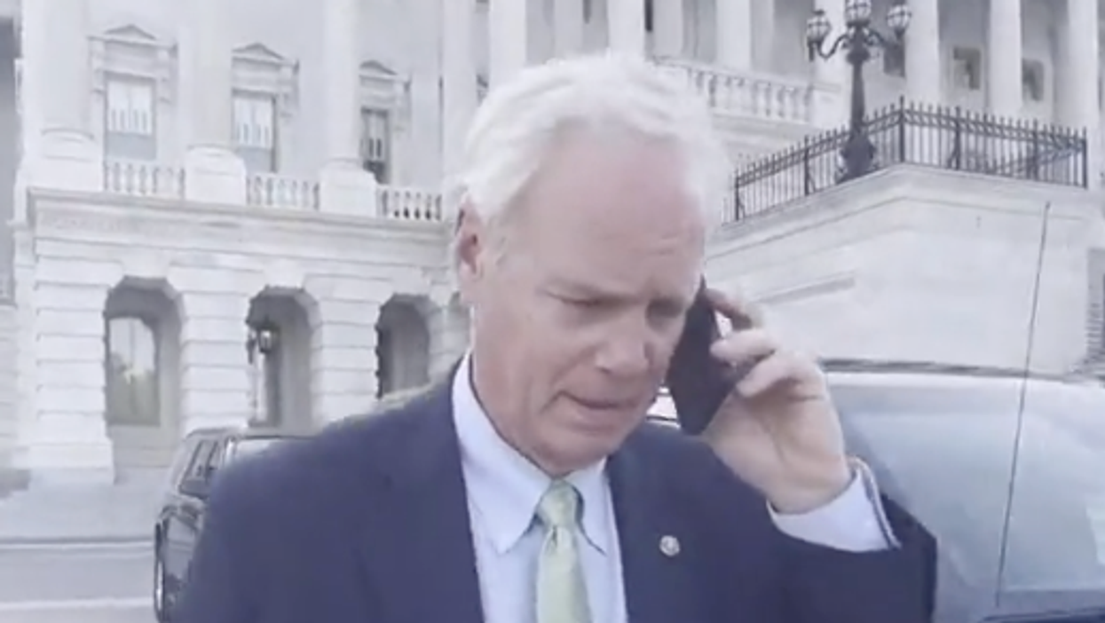 Busted: Ron Johnson caught faking a phone call when questioned by reporters
