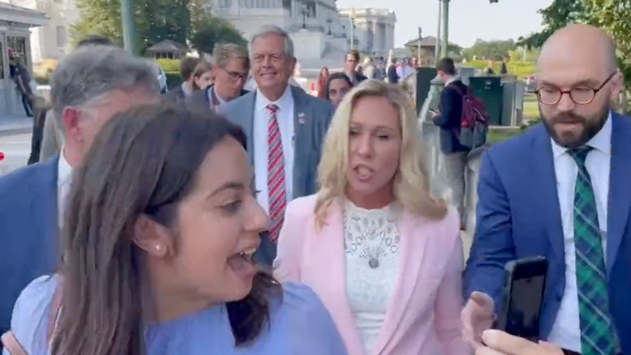 Watch: Marjorie Taylor Greene accused of kicking woman after telling activist to 'move to another country'