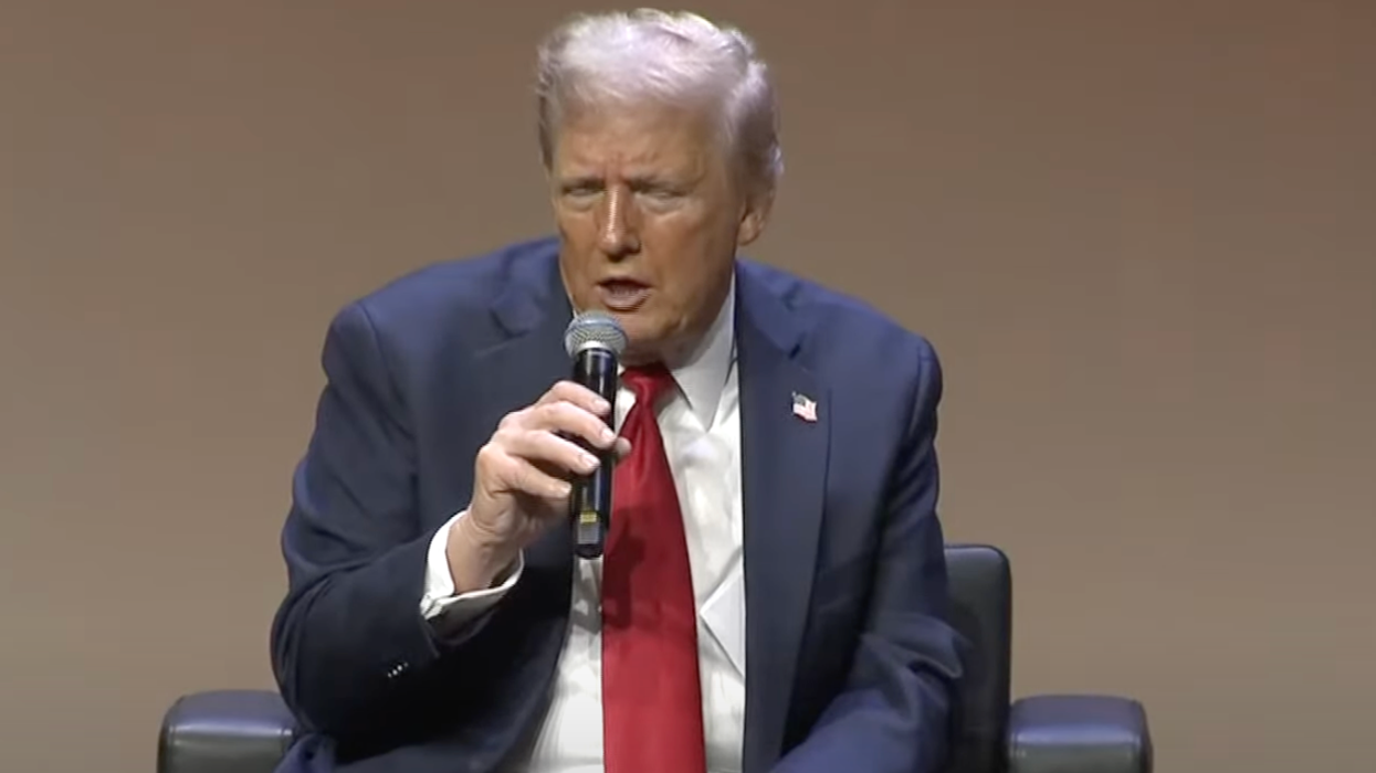 Trump stands silently for 'God Bless the USA' then trashes Detroit to Detroit Economic Club