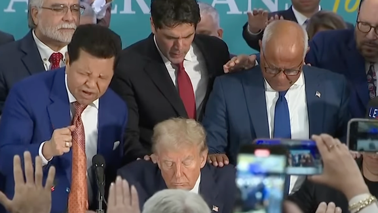 'Charlatan' pastor at Latino event lays hands on Trump, prays God makes him president