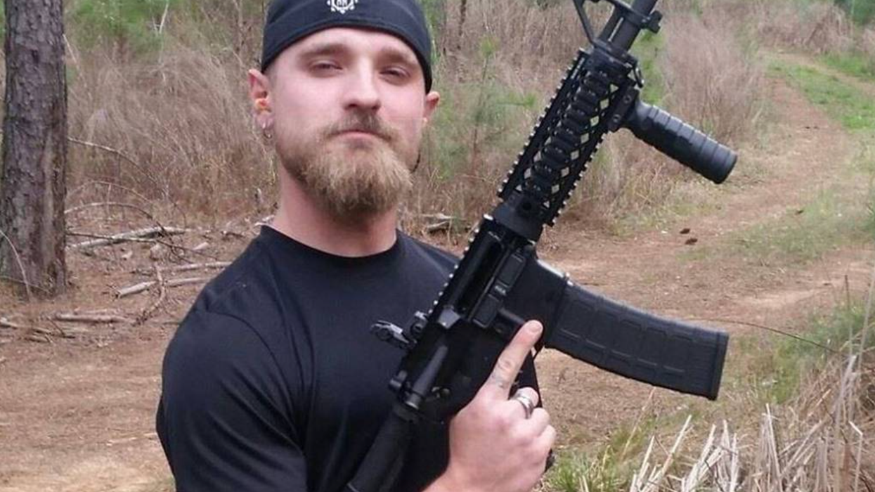 Conspiracy theorist who attacked pizzeria 'with loaded weapons' shot dead during traffic stop
