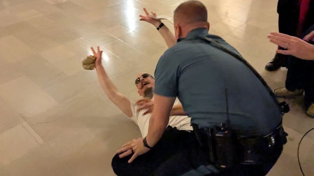 'Punched me in the face': Satanists and Catholics arrested after clash in Kansas Capitol