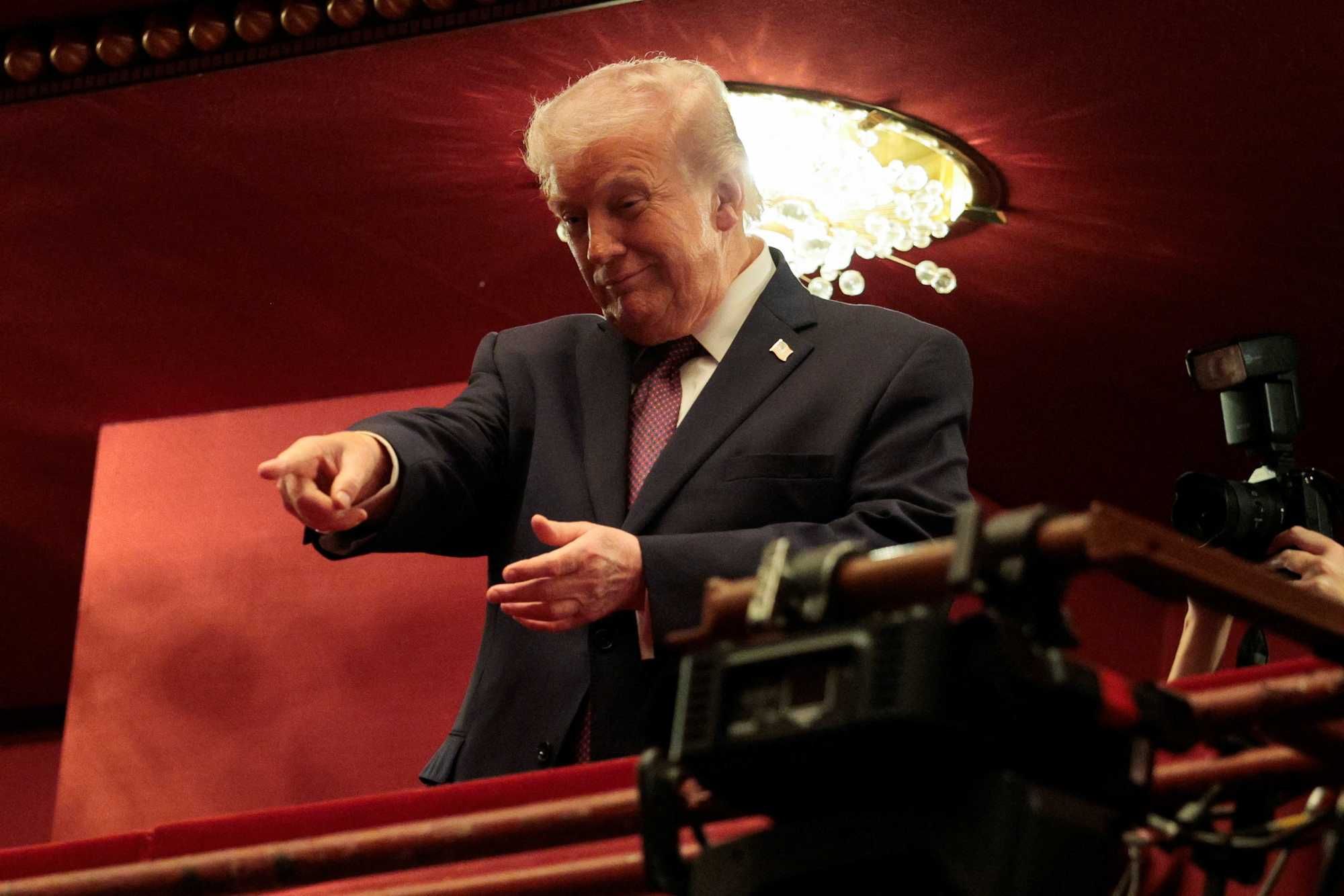 President Donald Trump gestures as he attends a show at the John F. Kennedy Memorial Center for the Performing Arts, in Washington, D.C., March 31, 2026. REUTERS/Evan Vucci