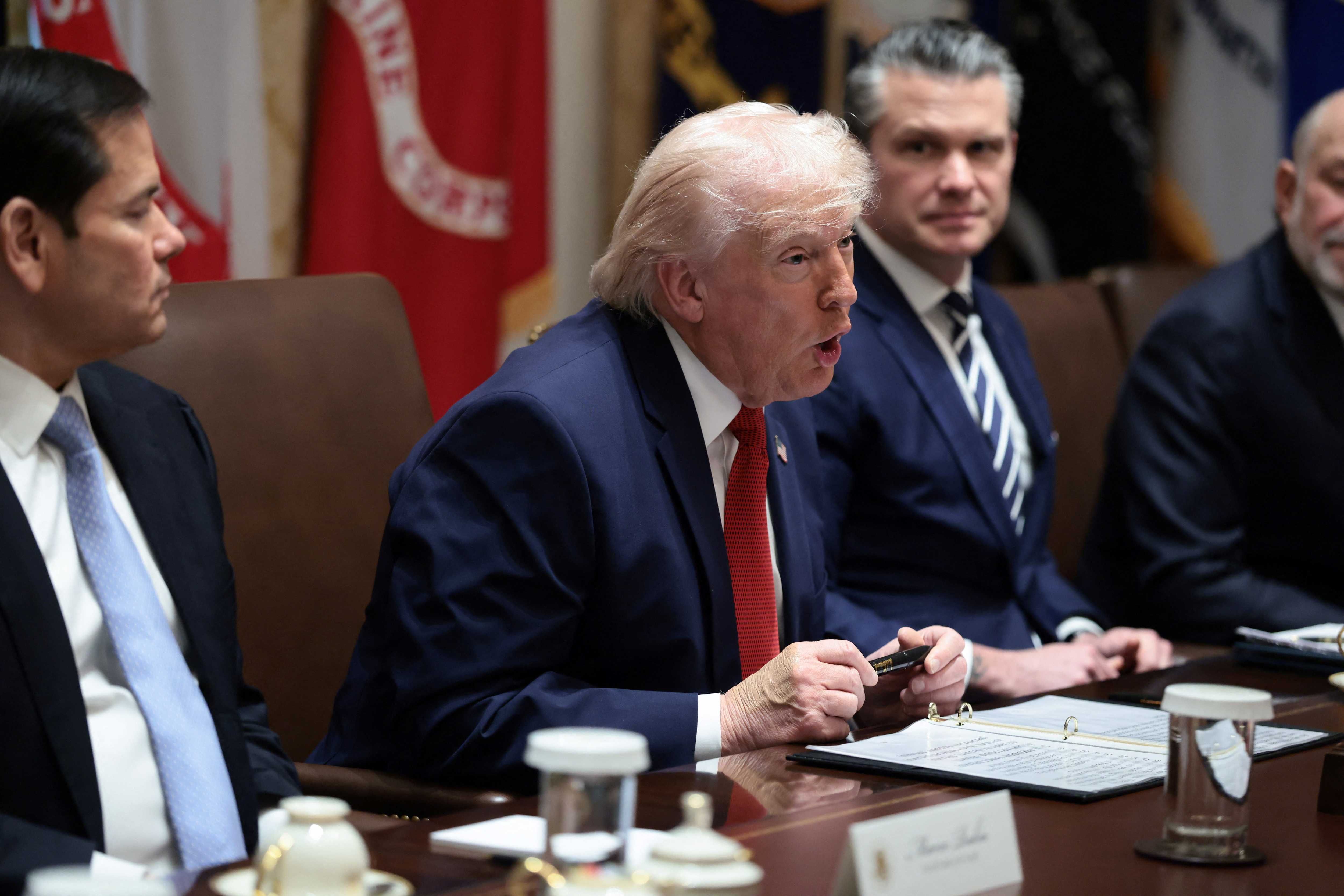 U.S. President Donald Trump holds a Sharpie pen that was custom-made for the White House, during a cabinet meeting at the White House in Washington, D.C., U.S., March 26, 2026.