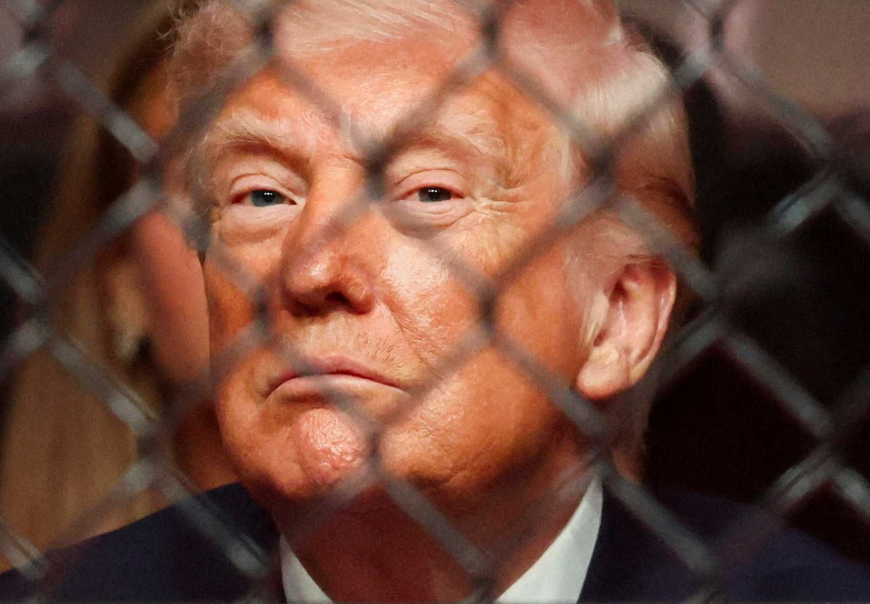 U.S. President Donald Trump watches a match during the UFC 327 event at Kaseya Center in Miami, Florida, U.S., April 11, 2026.