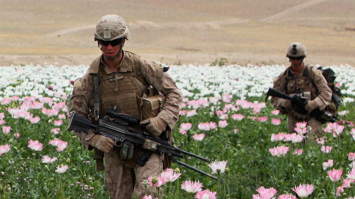 Marines with 2nd Battalion, 5th Marine Regiment, patrol through Musa Qaleh District, Afghanistan, April 17, 2012. During Operation Lariat, Marines engaged in multiple firefights with insurgents before searching suspicious compounds.