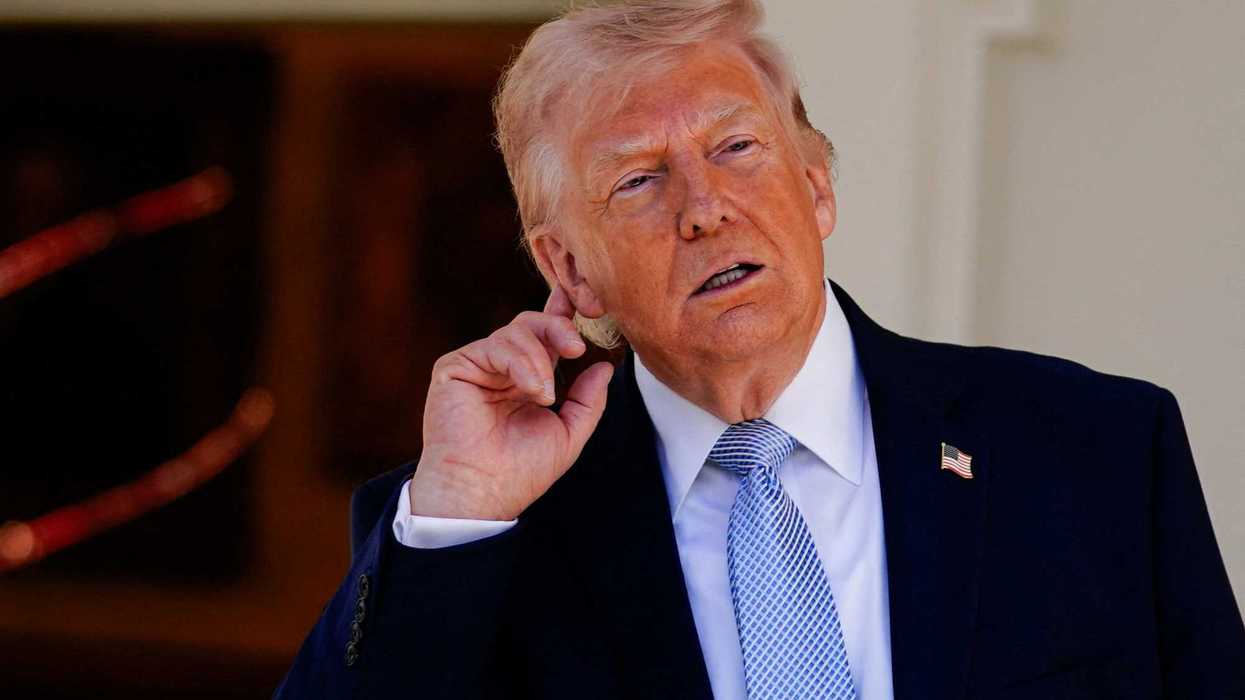 President Donald Trump gestures as he heads back to the Oval Office, on the day of the 2026 White House Easter Egg Roll, in Washington, D.C., April 6, 2026. REUTERS/Nathan Howard