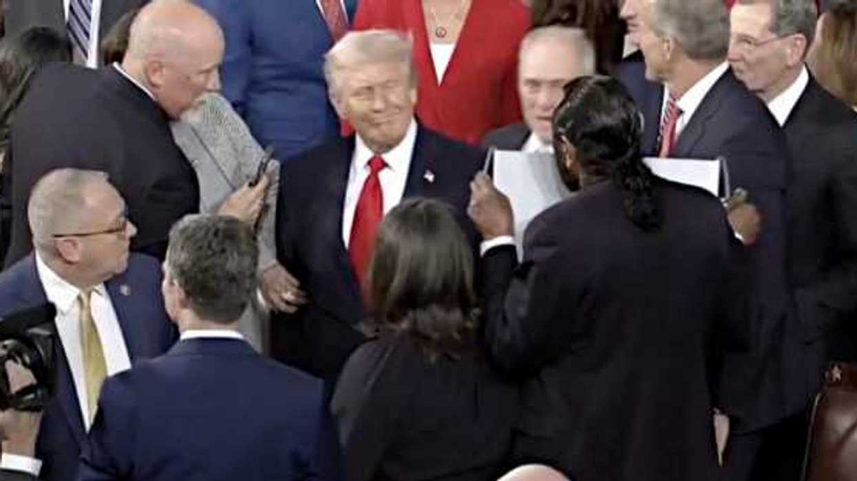 Trump confronted with sign saying 'Black people aren't apes' at State of the Union