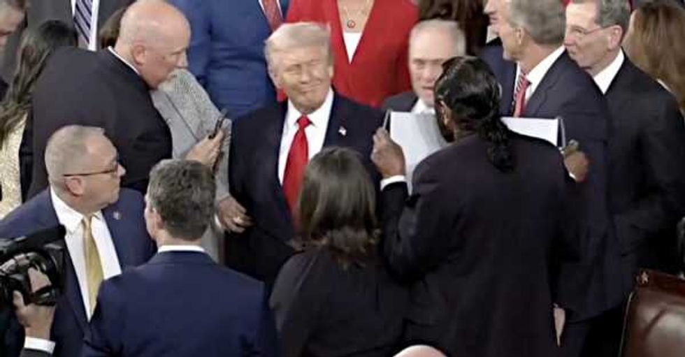 Trump confronted with sign saying 'Black people aren't apes' at State of the Union