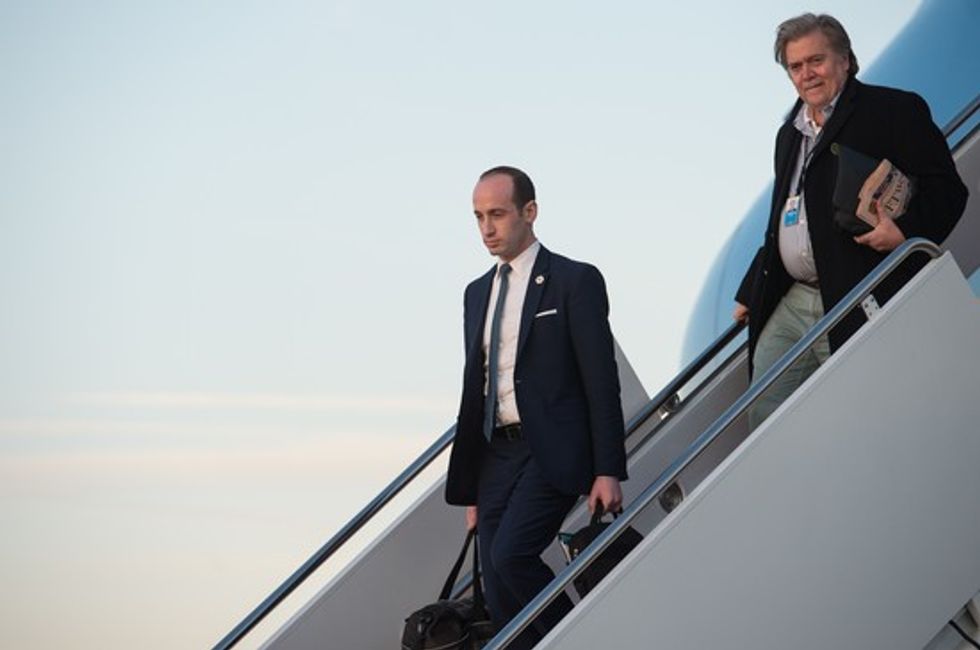 Senior White House advisers Stephen Miller (L) and Steve Bannon step off Air Force One at Andrews Air Force Base in Maryland, on March 5, 2017. / AFP PHOTO / NICHOLAS KAMM        (Photo credit should read NICHOLAS KAMM/AFP/Getty Images)