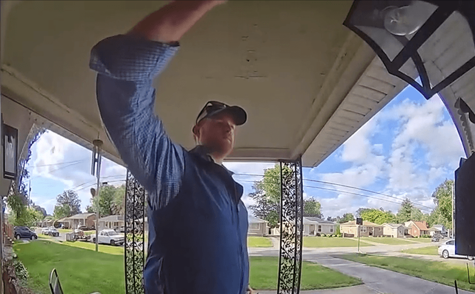 Red state candidate caught on camera stealing political flyer from mailbox