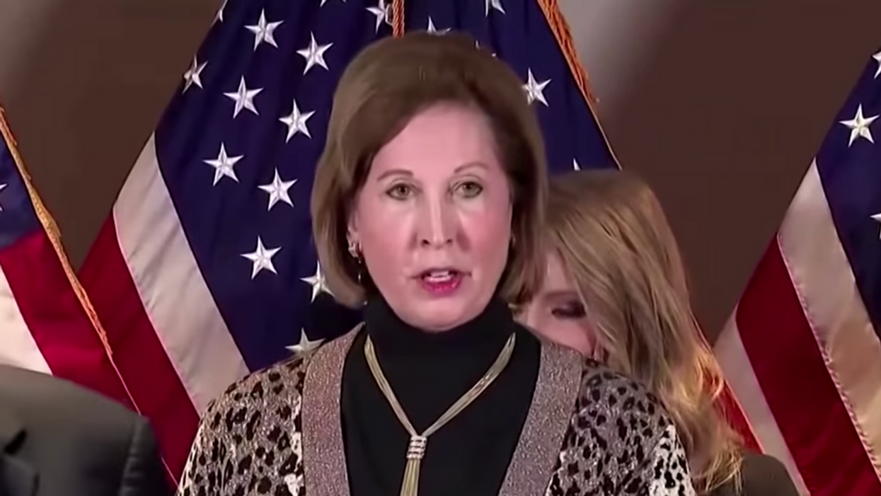 Man linked to Proud Boys charged for Capitol riots after FBI identified him in a recent photo with Sidney Powell