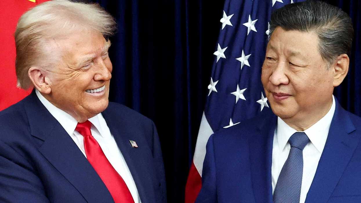 U.S. President Donald Trump and Chinese President Xi Jinping react as they hold a bilateral meeting at Gimhae International Airport, on the sidelines of the Asia-Pacific Economic Cooperation (APEC) summit, in Busan, South Korea, October 30, 2025.