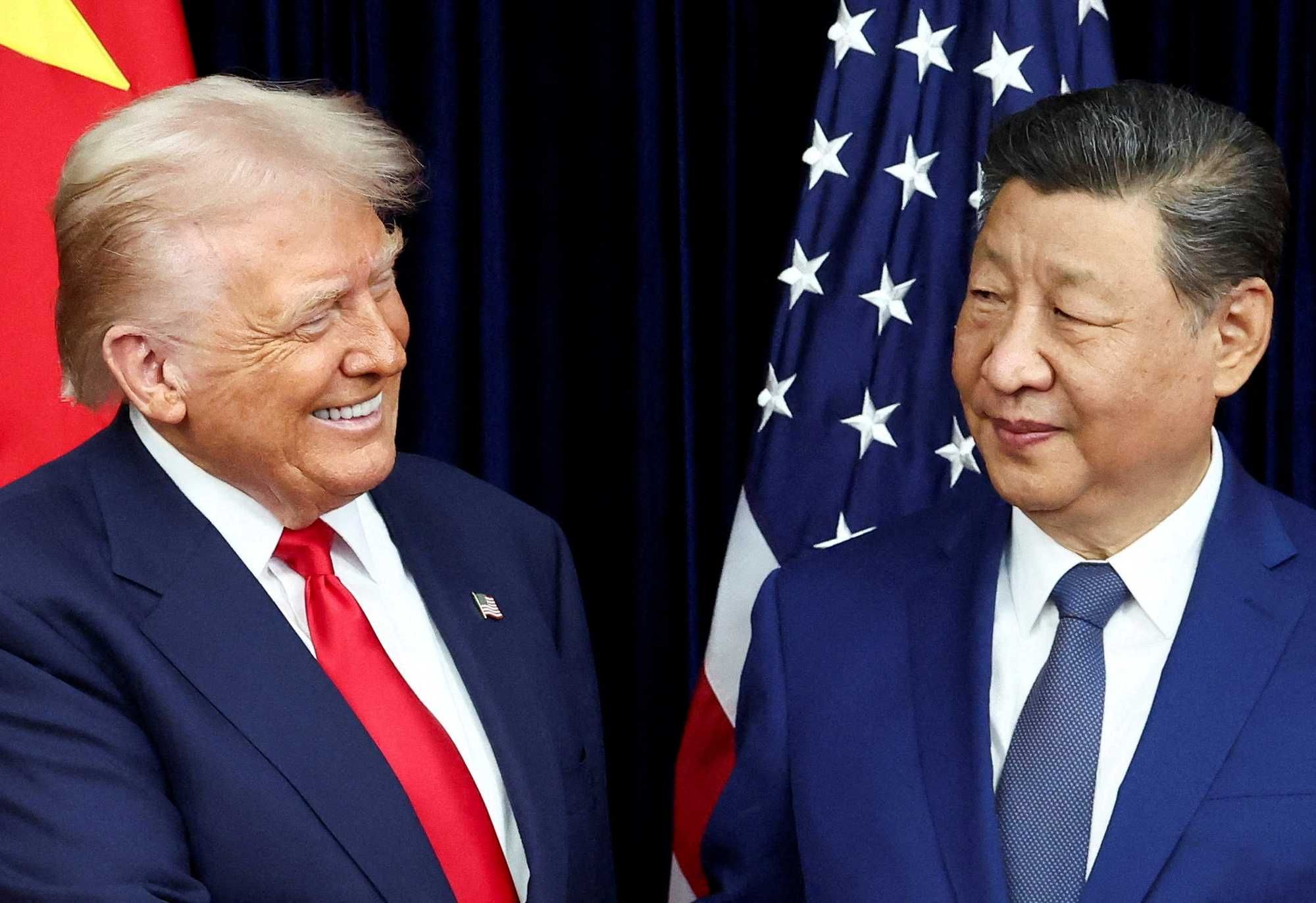 U.S. President Donald Trump and Chinese President Xi Jinping react as they hold a bilateral meeting at Gimhae International Airport, on the sidelines of the Asia-Pacific Economic Cooperation (APEC) summit, in Busan, South Korea, October 30, 2025.