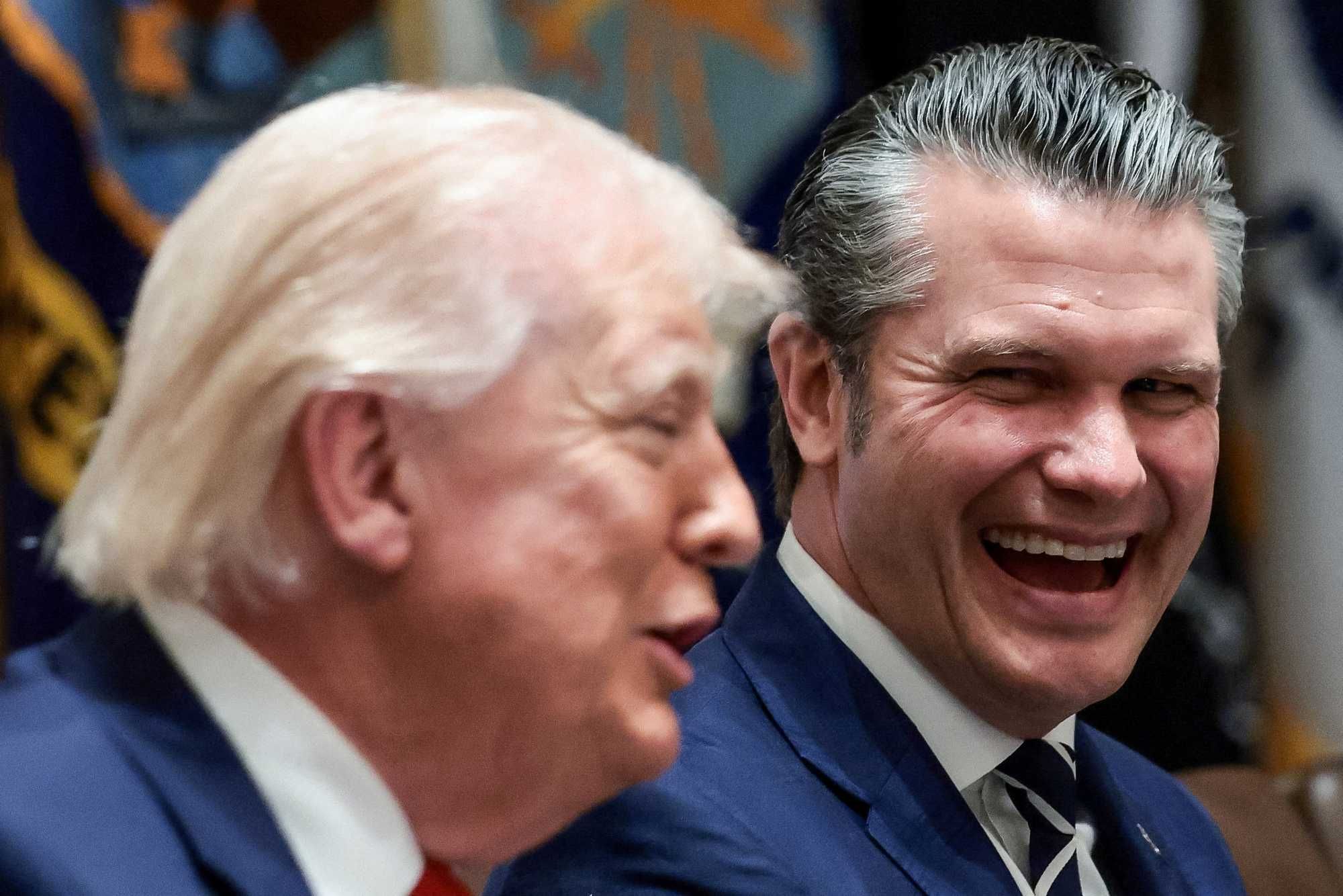 U.S. President Donald Trump and Defense Secretary Pete Hegseth react during a cabinet meeting at the White House in Washington, D.C., U.S., March 26, 2026.