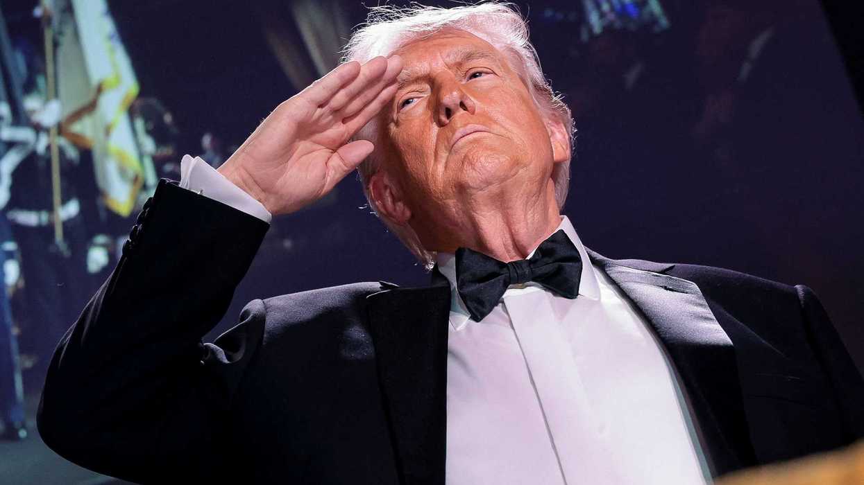 U.S. President Donald Trump salutes during the annual White House Correspondents' Association dinner in Washington, D.C., U.S., April 25, 2026.