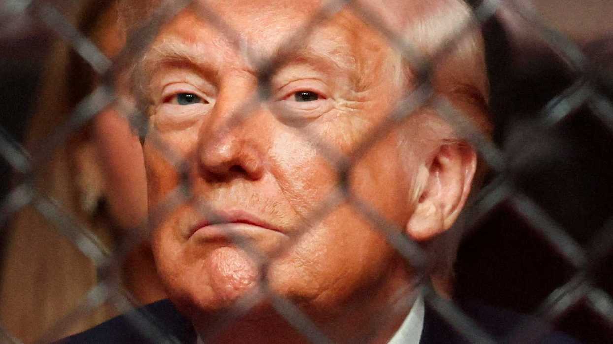 U.S. President Donald Trump watches a match during the UFC 327 event at Kaseya Center in Miami, Florida, U.S., April 11, 2026. REUTERS/Kevin Lamarque