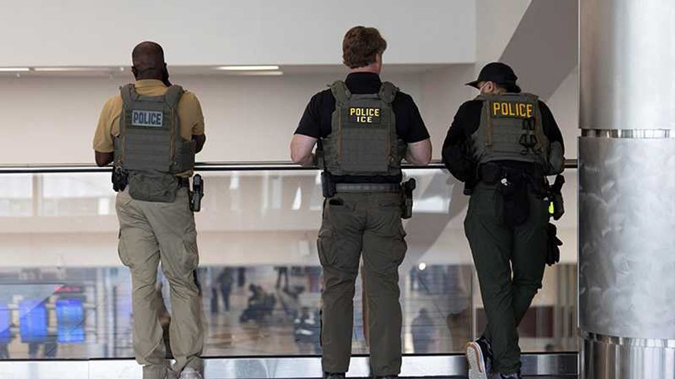 Photos of federal agents standing around airports doing nothing draw criticism